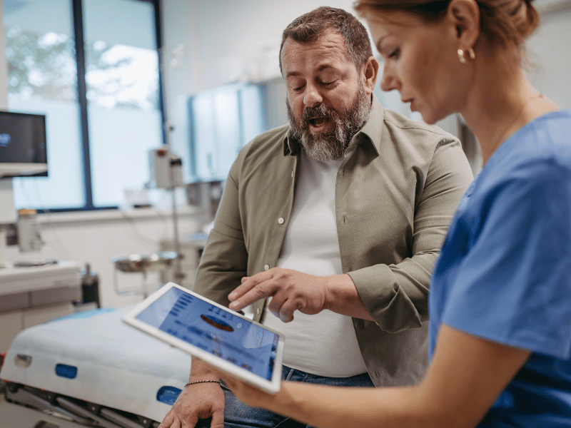 a man speaking to a doctor about his health