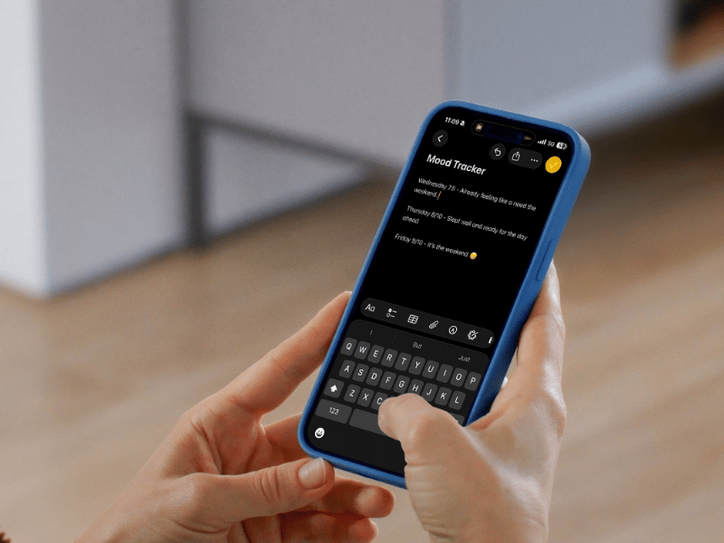 a picture of a woman holding an iPhone